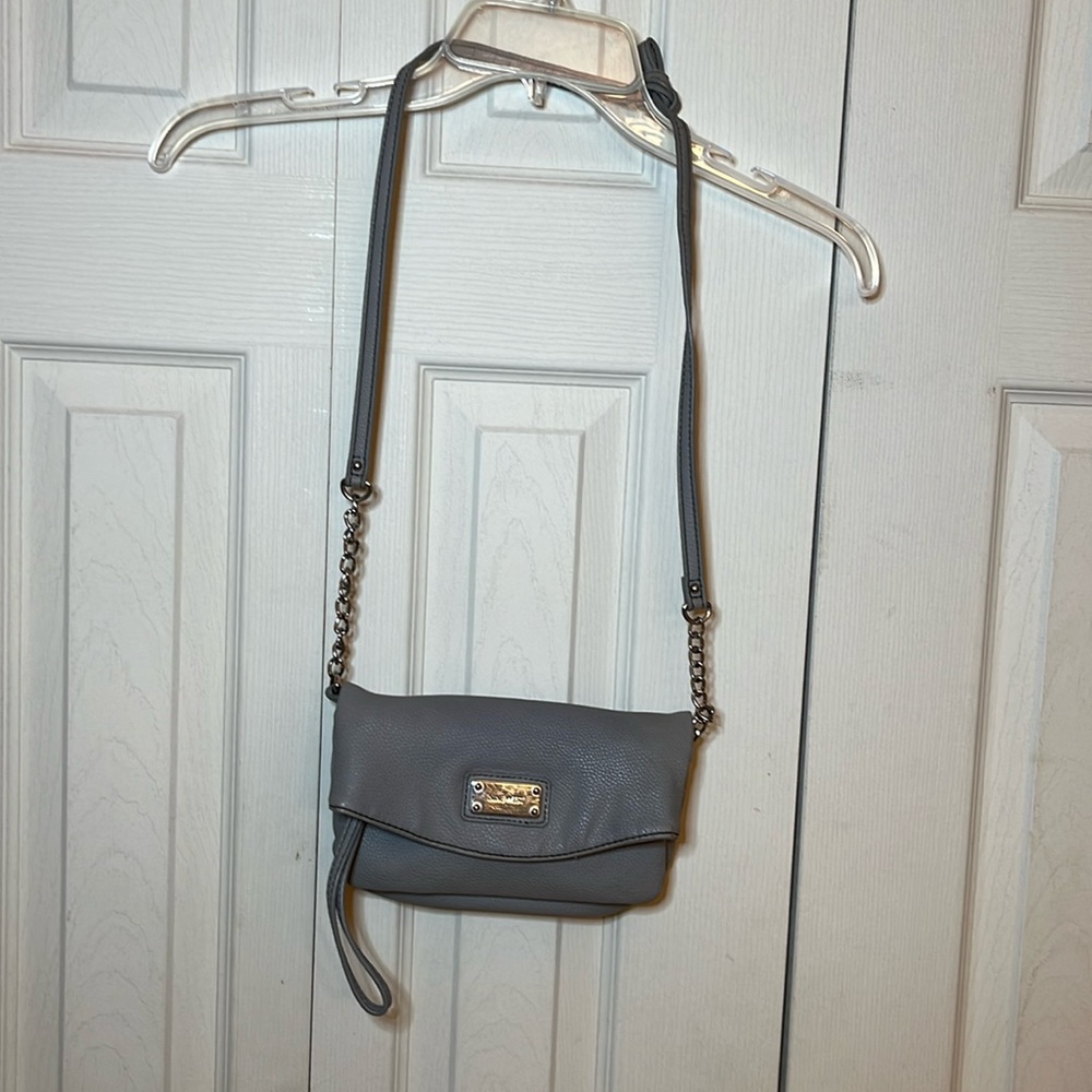 Nine West pocket book. Blue. 8” long. 5” width. Partial Silver chain for strap.